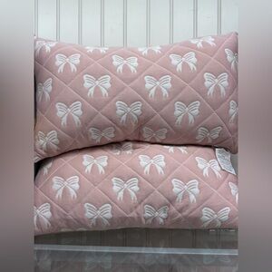 2 Pink and White Bow Patterned Pillows